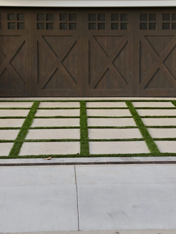 Farmhouse style garage door with decorative driveway